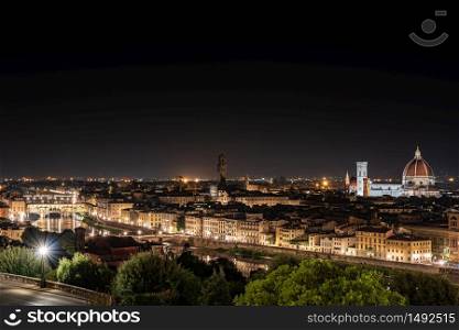 Night view of Florence. Ponte Vecchio, Arno river, Cathedral of Santa Maria del Fiore and church of Santa Croce. Horizontal image