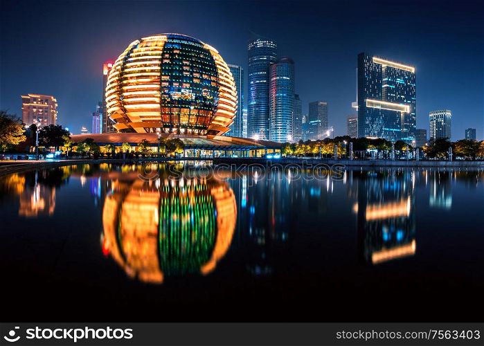 Night view of illuminated Qianjiang New Town with reflection, Hangzhou, Zhejiang, China. Night view of Qianjiang New Town with reflection, Hangzhou, Zhejiang, China