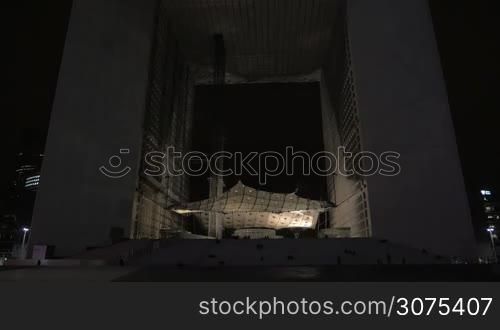 Night view of La Grande Arche. It is a monument and building in the business district of La Defense at height 110 metres