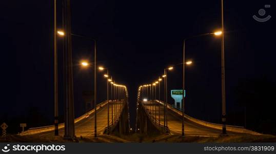 Night view of Si Surat bridge in Surat Thani, Thailand. Si Surat bridge is crossing bridge of Tapi river.
