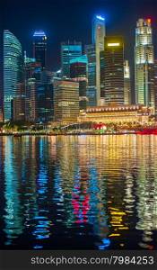 Night view of Singapore Downtown Core with reflection in the river