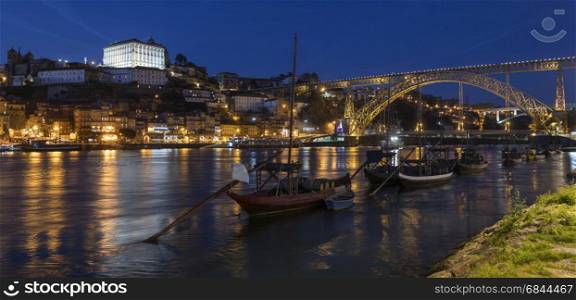 Night view of the city of Oporto (or Porto) in Portugal. Porto is one of the oldest European ports, and its historical centre was proclaimed a World Heritage Site by UNESCO in 1996. One of Portugal's internationally famous exports, port wine, is named after Porto, since the cellars of Vila Nova de Gaia, were responsible for the packaging, transport and export of the fortified wine.