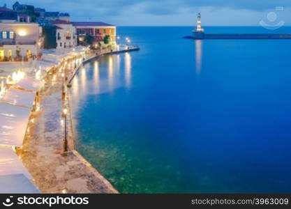 Night view of the quay with lanterns and the old harbor in Chania. Greece.. Chania. The old harbor at night.