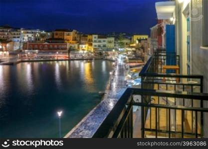 Night view of the quay with lanterns and the old harbor in Chania. Greece.. Chania. The old harbor at night.