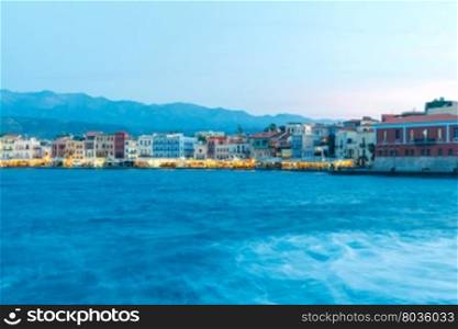 Night view of the quay with lanterns and the old harbor in Chania. Greece.. Chania. The old harbor at night.