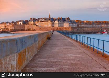 Night view of walled city Saint-Malo with St Vincent Cathedral, famous port city of Privateers is known as city corsaire, Brittany, France. Medieval fortress Saint-Malo, Brittany, France