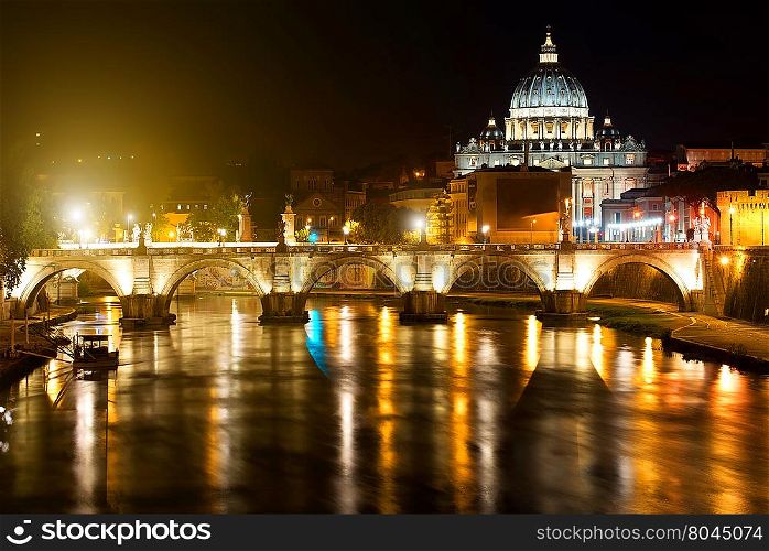Night view on the Sant&rsquo; Angelo Bridge and Basilica of St. Peter in Rome, Italy