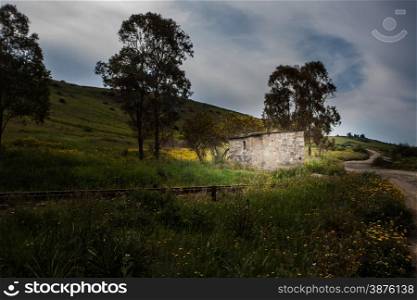 Nightime stone house campaign. Stone house in an old grade crossing