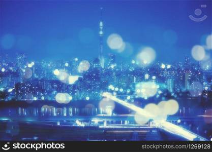 Nightlife Background in Tokyo. Tokyo Skyline with Blur Bokeh Lights Decoration in Colorful Filter. Tokyo Sky Tree Cityscape Background. Night sky and nightlife concept in Tokyo city.