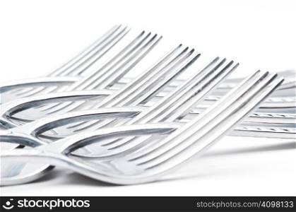 Nine Forks on white with shallow depth of field