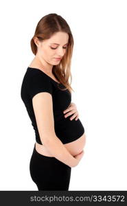 Nine month pregnant woman with hands holding belly isolated over white background.