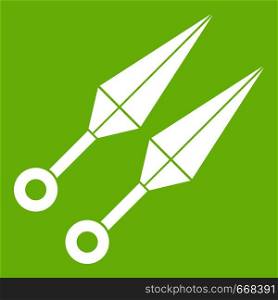 Ninja weapon kunai, throwing knives icon white isolated on green background. Vector illustration. Ninja weapon kunai icon green