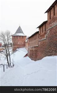 Nizhny Novgorod Kremlin wall and Zachatskaya tower in winter time. Russia