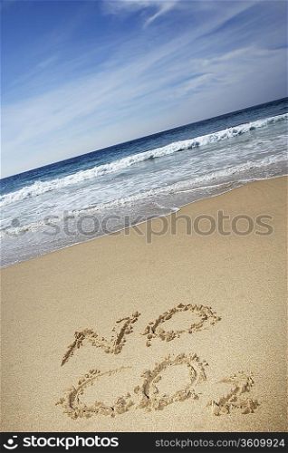 No CO2 text written on beach, elevated view