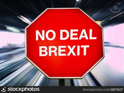 No Deal Brexit written on octagon stop sign with blur zoom in background. Sense of urgency at upcoming October 31st, 2019 deadline where the default position is the UK leaves the EU with no deal. No Deal Brexit written on octagon stop sign with blur zoom in background