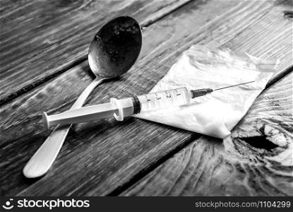 No drugs. A syringe, a spoon and drugs in black and white.