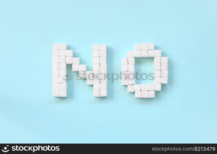 NO Letters of sugar cubes on a pastel blue background. Diabetic concept. Refusing sugar. Flat lay minimal top view. Refusing sugar sign with big letters on blue background