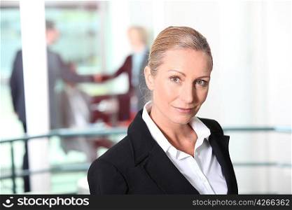 No-nonsense businesswoman in an office environment