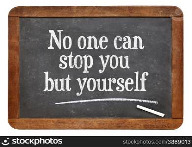 No one can stop you but yourself. Motivational text on a vintage slate blackboard