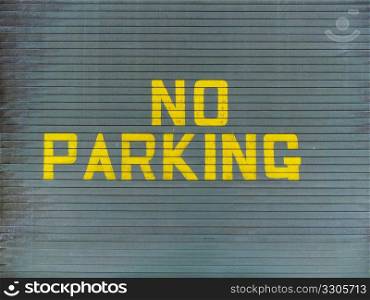 No parking painted on a metallic garage door