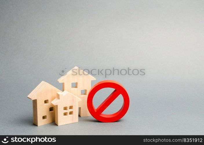 No Sign and the wooden house on an gray background. Unavailability of housing, busy or low supply. Inaccessible and expensive housing. Seizure and freezing of assets by a bank, court. Selective focus