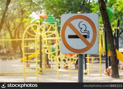 no smoking metal sign in the park.