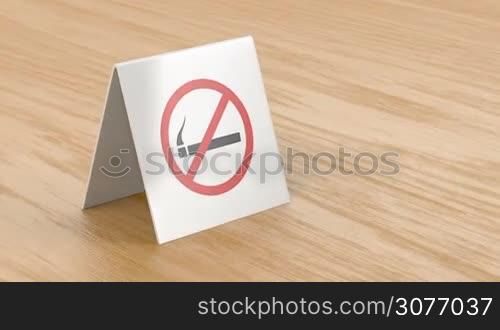 No smoking sign on wooden table in the restaurant or cafe