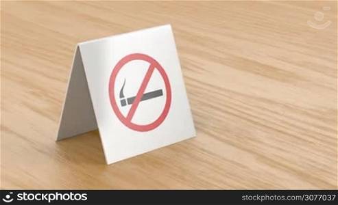 No smoking sign on wooden table in the restaurant or cafe