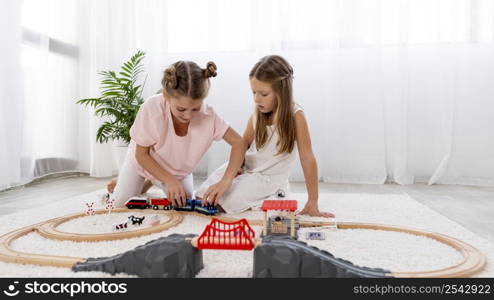 non binary children playing with cars game indoors