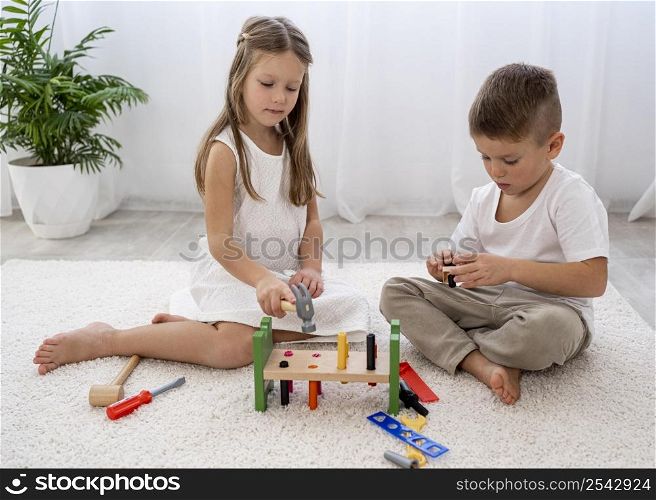 non binary children playing with colorful game