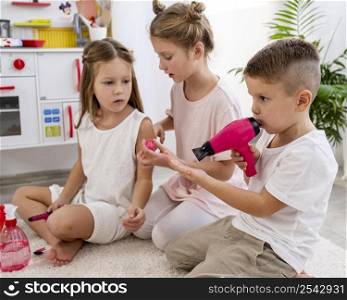 non binary kids playing beauty salon game together
