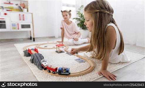 non binary kids playing with car game