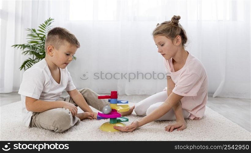 non binary kids playing with educational game