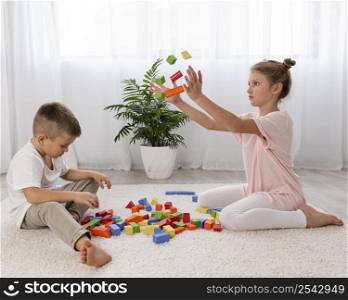 non binary kids playing with educational game together