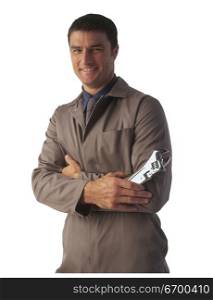 non-specific tradesman holding an adjustable wrench.