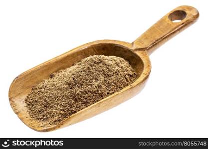 noni fruit powder on a rustic wooden scoop, isolated on white
