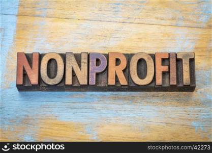 nonprofit banner - word abstract in vintage letterpress printing blocks stained by color inks