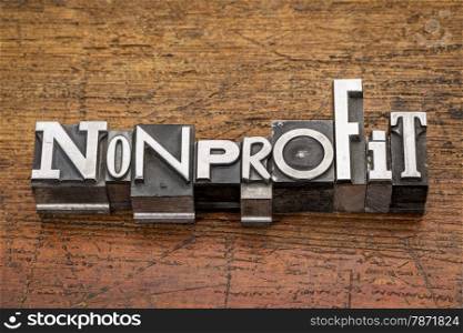 nonprofit word in mixed vintage metal type printing blocks over grunge wood