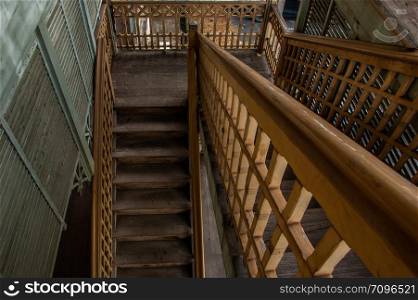 Nonthaburi, Thailand - JUL 21,2019 : The stairs to the 2nd floor of old city hall, European style building. The vintage white wooden house was left to deteriorate over time, Once be Former city hall. Established on 1548, is tranformed to be the museum of Nonthaburi in 2009.