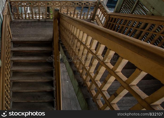 Nonthaburi, Thailand - JUL 21,2019 : The stairs to the 2nd floor of old city hall, European style building. The vintage white wooden house was left to deteriorate over time, Once be Former city hall. Established on 1548, is tranformed to be the museum of Nonthaburi in 2009.