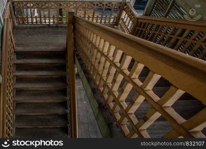 Nonthaburi, Thailand - JUL 21,2019 : The stairs to the 2nd floor of old city hall, European style building. The vintage white wooden house was left to deteriorate over time, Once be Former city hall. Established on 1548, is tranformed to be the museum of Nonthaburi in 2009.