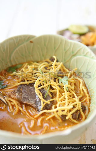 Noodle Khao soi , Thai food on wood background