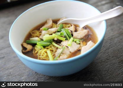 noodle with pork on wood background