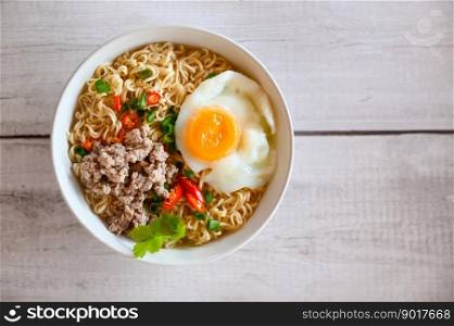 noodles bowl with boiled egg minced pork vegetable spring onion lemon lime lettuce celery and chili on table food , instant noodles cooking tasty eating with bowl noodle soup - top view