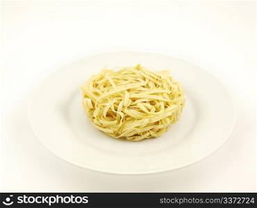 Noodles. Round noodle, isolated on white plate, towards white background