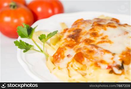 Noodles topped with tomato sauce and grated cheese