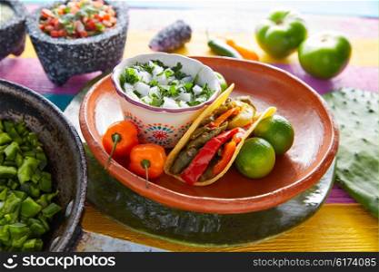 Nopal taco mexican food with chili pepper and ingredients on colorful table