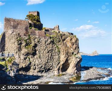 Norman castle in Aci Castello village and Cyclopean Rocks (Islands of the Cyclops), Sicily, Italy