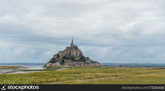 Normandy abbey attraction for vacation tourism in cloudy weather