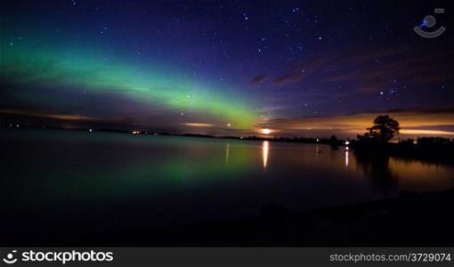Northern Lights over the lake in Sweden